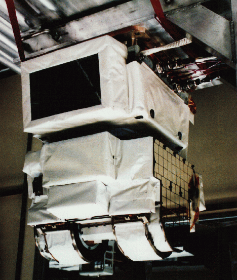 This picture shows the CERES instrument before it was installed on the TRMM satellite. The white fabric protects the instrument from atomic oxygen in the upper parts of our atmosphere. Three detectors rotate within the semi-circular housing to make Earth energy measurements.