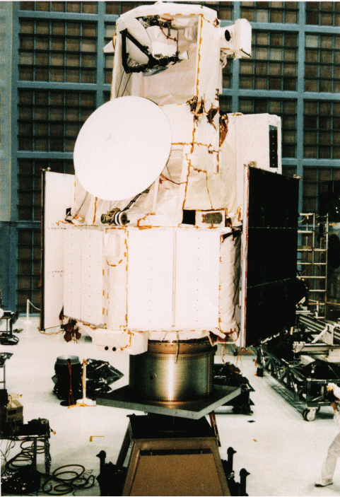 Space-facing side of TRMM Spacecraft Antennae for Communication with Earth stations and TDRSS dominate this view of the spacecraft. Undeployed solar panels are visible on either side.